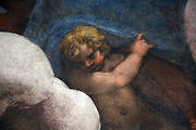 A putto with a blue cloth. Detail of the dome